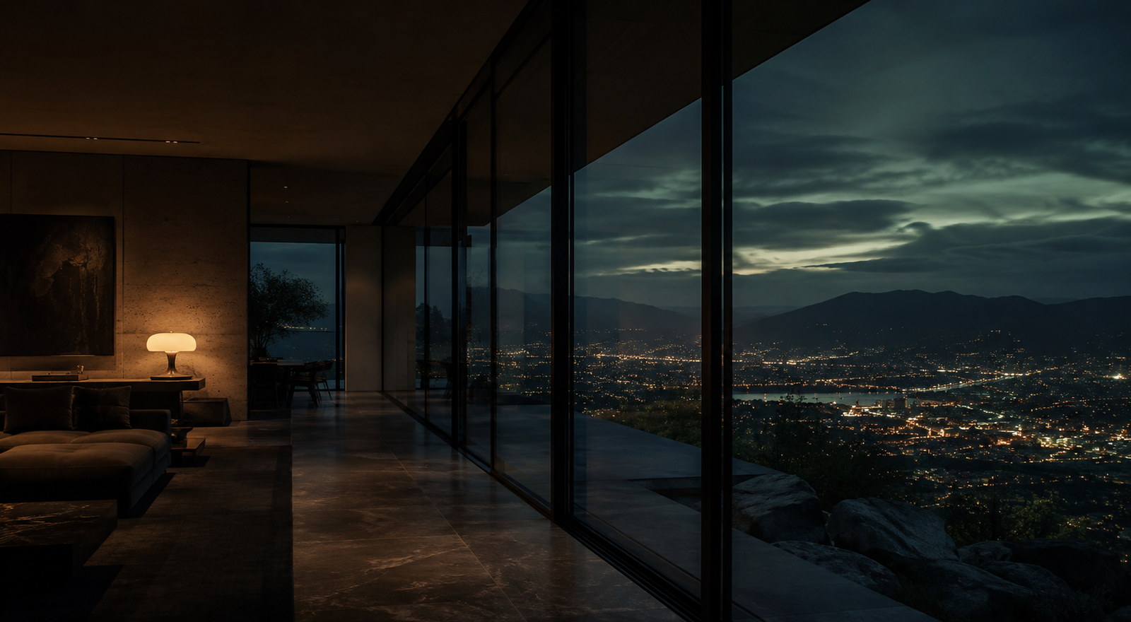 Furnished apartment interior with warm lamplight and a valley view